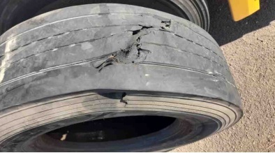 Truck tyre damaged by an object